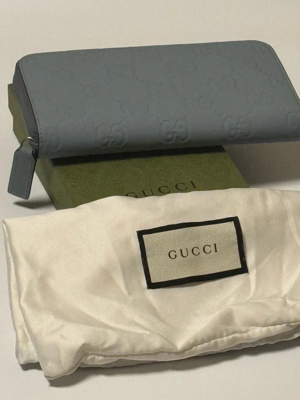 Gucci Light Blue Embossed GG Zip-Around Wallet